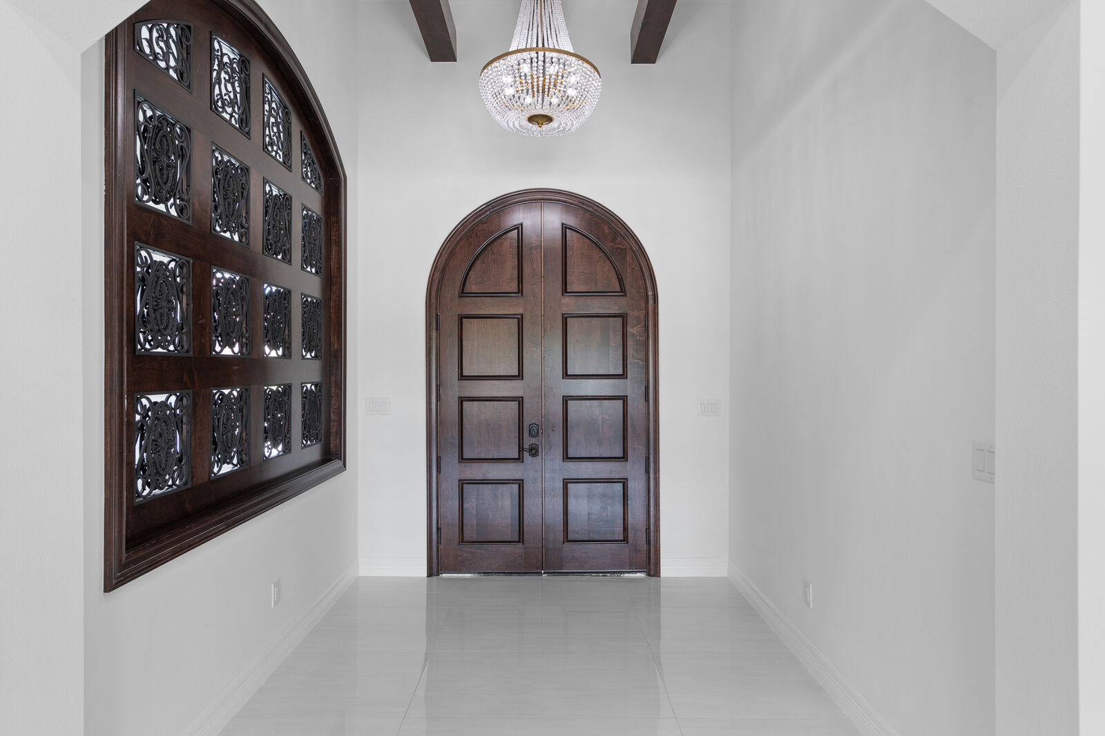 Grand entry hall with custom wood doors